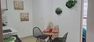 a dining room with a table and chairs at apartaestudios completos in Manizales
