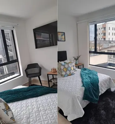 a bedroom with a bed and a window at apartaestudios completos in Manizales