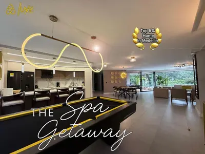 a dining room and kitchen with a pool table at Amazing apartment with Private Luxury Sauna Jacuzzi Steam Room Pool Table in Medellín