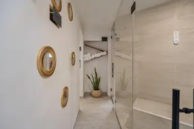 a bathroom with a shower and a glass shower stall at Amazing apartment with Private Luxury Sauna Jacuzzi Steam Room Pool Table in Medellín