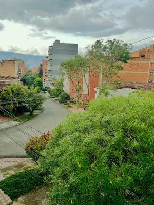 a view of a street in a city with buildings at Loft Laureles - Excellent location in Medellín