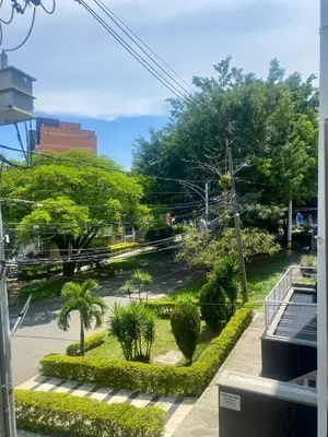 a view of a street with trees and bushes at Loft Laureles - Moderno y amplio in Medellín