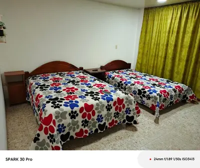 two beds sitting next to each other in a room at Apartamento en el centro de Riosucio in Ruiosucio