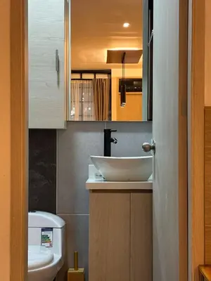 a bathroom with a sink and a toilet at Modern Loft Puerta de Laureles Medellin in Medellín