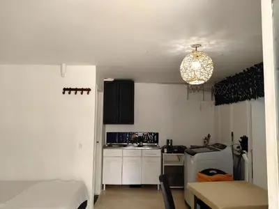 a small kitchen with a sink and a stove at Apartaestudio Centro Histórico Medellín in Medellín