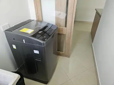 a trash can sitting next to a refrigerator at Loft urbano cerca a cable plaza in Manizales