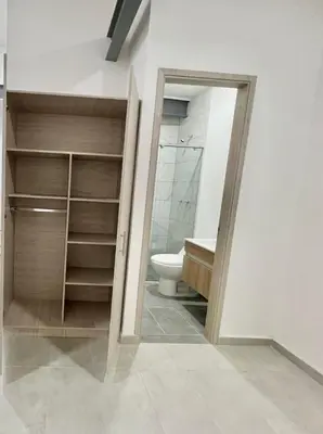 a bathroom with a toilet and a sink at Espectacular Apartaestudio Batallon Manizales in Manizales