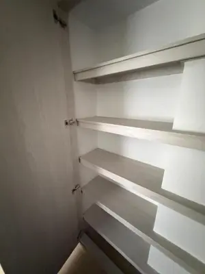 a empty closet with white shelves in it at Moderno y acogedor apartamento en sabaneta in Sabaneta