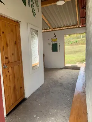 an empty room with a door and a window at El Edén in Guarne