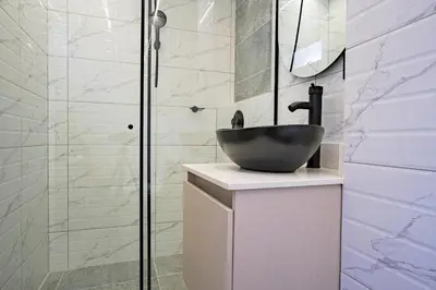 a bathroom with a sink and a shower at Hotel Loft 72 in Medellín