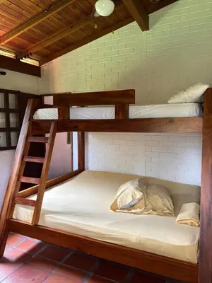 a bunk bed room with two bunk beds at Villa en Salgar - Bolombolo in Montenegro