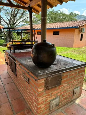 a pot sitting on top of a brick stove at Villa en Salgar - Bolombolo in Montenegro