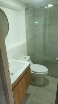 a bathroom with a toilet and a sink and a shower at Apartaestudio muy central entre zonas rosas in Manizales