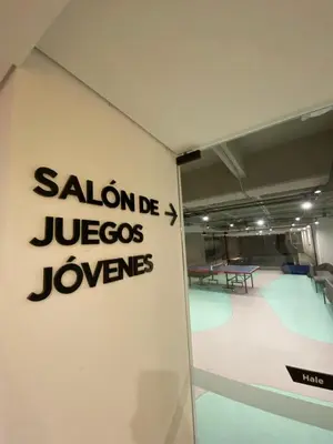 a wall with a sign that reads salonda jucosolves at Art, design and urban life in Medellín loft in Medellín