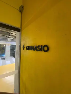a sign on a yellow wall with the word givismo on it at Art, design and urban life in Medellín loft in Medellín