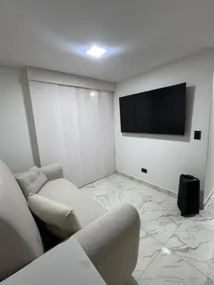 a living room with a couch and a flat screen tv at Apartment in Itagui, excellent location in Itagüí