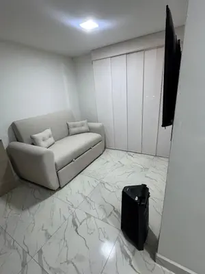 a living room with a couch and a flat screen tv at Apartment in Itagui, excellent location in Itagüí