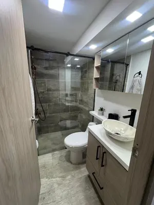 a bathroom with a toilet and a sink and a shower at Apartment in Itagui, excellent location in Itagüí