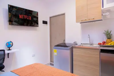 a kitchen with a sink and a counter top at Sencia Apartamentos Boutique in Medellín