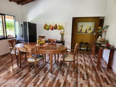 a kitchen and dining room with a table and chairs at Eco-paradise in coffee heartland in Marulanda