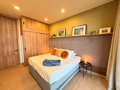 a bedroom with a large bed in a room at Montecielo Lodge 11 El peñol - Guatape in Chiquinquirá
