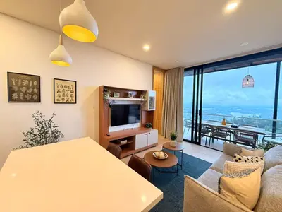 a living room with a table and a large window at Montecielo Lodge 11 El peñol - Guatape in Chiquinquirá
