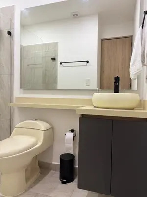 a bathroom with a toilet and a sink at Industrial Loft near Poblado, Medellín in Medellín