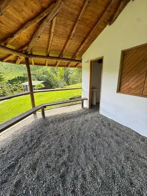 a porch of a house with a bench at Cabañas con vista al Embalse in La Pradera