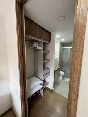 a bathroom with a walk in closet with a toilet at Reposso Laureles in Medellín