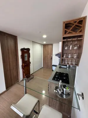 a kitchen with a stove and a counter top at Reposso Laureles in Medellín