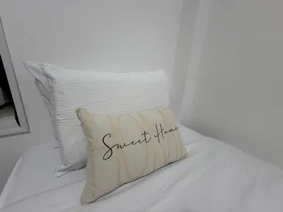 a pillow sitting on top of a bed at Casa Bendita - Apto 101 in Medellín