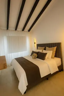 a bedroom with a large bed in a room at Casa G, en Rionegro in Rionegro
