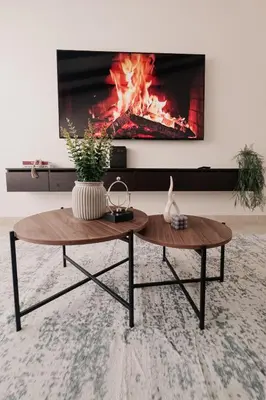 a living room with a fireplace and a coffee table at Casa G, en Rionegro in Rionegro
