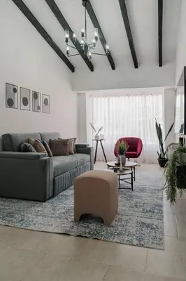 a living room with a couch and a rug at Casa G, en Rionegro in Rionegro