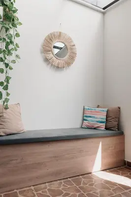 a room with a bench and a mirror on the wall at Casa G, en Rionegro in Rionegro