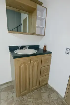 a bathroom with a sink and a mirror at Maranatha Jacuzzi, Rooftop BBQ, Sopetran Antioquia in Sopetran