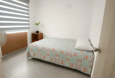a bedroom with a bed and a window at Maranatha Jacuzzi, Rooftop BBQ, Sopetran Antioquia in Sopetran