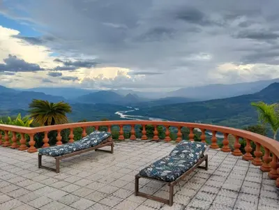 two chairs on a balcony with a view of mountains at Rurals Casa in Marsella