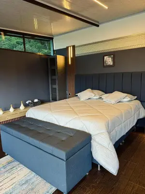 a bedroom with a large bed in a room at Altos del Silencio in San Rafael