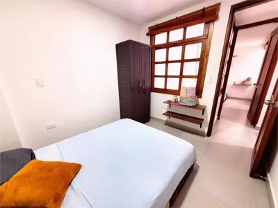 a small bedroom with a bed and a window at Apartment 202 Garden Shelter - 10 min to Balandú Park in Jardin