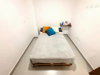 a small room with a bed in the corner at Apartment 202 Garden Shelter - 10 min to Balandú Park in Jardin