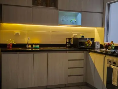 a kitchen with a sink and a microwave at Casa Linda Zona Rosa Buenos Aires, Natural Garden in Medellín