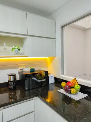 a kitchen with a counter top with bowls of fruit at Casa Linda Zona Rosa Buenos Aires, Natural Garden in Medellín