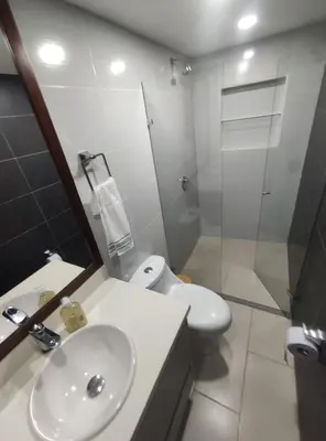 a bathroom with a sink and a toilet and a shower at Casa Linda Zona Rosa Buenos Aires, Natural Garden in Medellín