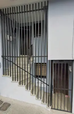 a row of bars on the side of a building at Modern Loft in Zona Rosa Buenos Aires WiFi 500Mb in Medellín