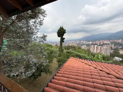 a view of a city from the roof of a house at AMAZING EL POBLADO VIEWs-MODERN VILLA in Envigado