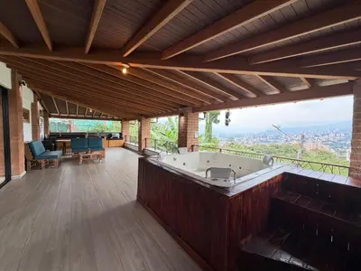 a large room with a large bath tub in a building at AMAZING EL POBLADO VIEWs-MODERN VILLA in Envigado