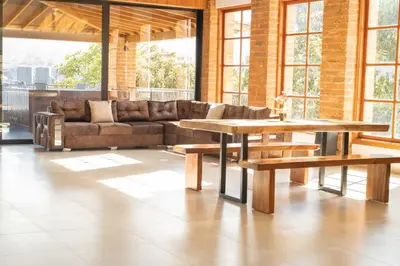 a living room with a couch and a table at AMAZING EL POBLADO VIEWs-MODERN VILLA in Envigado