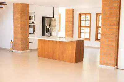 a kitchen with a sink and a counter in a room at AMAZING EL POBLADO VIEWs-MODERN VILLA in Envigado