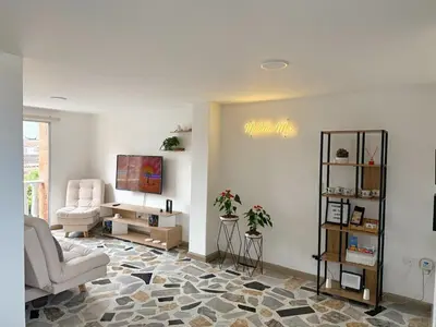 a living room with a couch and a table at Apartamento para 5 personas en Laureles, Estadio in Estación El Salto